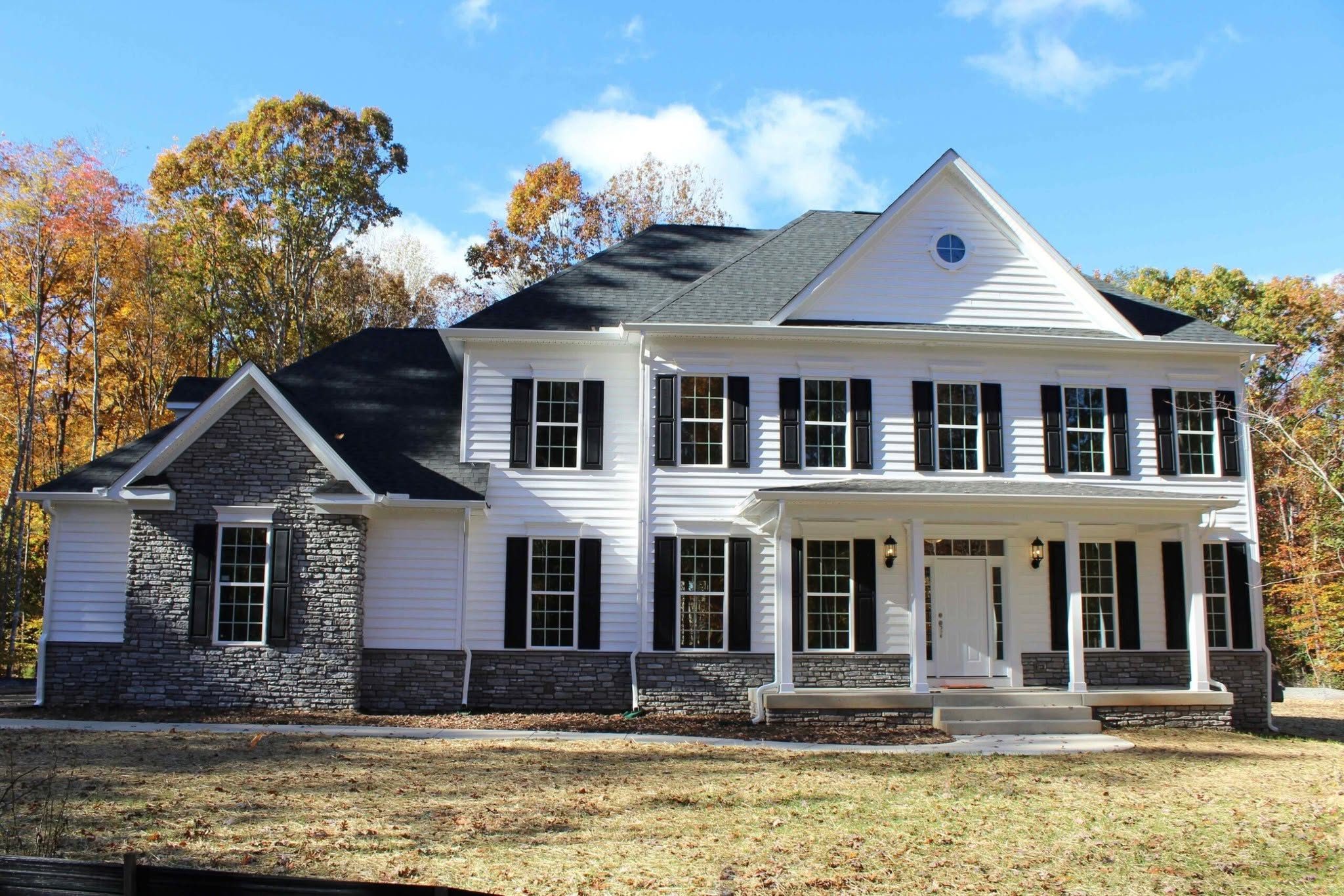 White custom home with stone accents