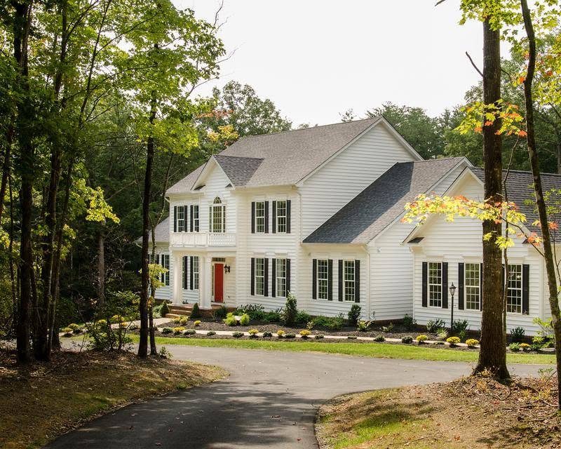 White custom home in the woods